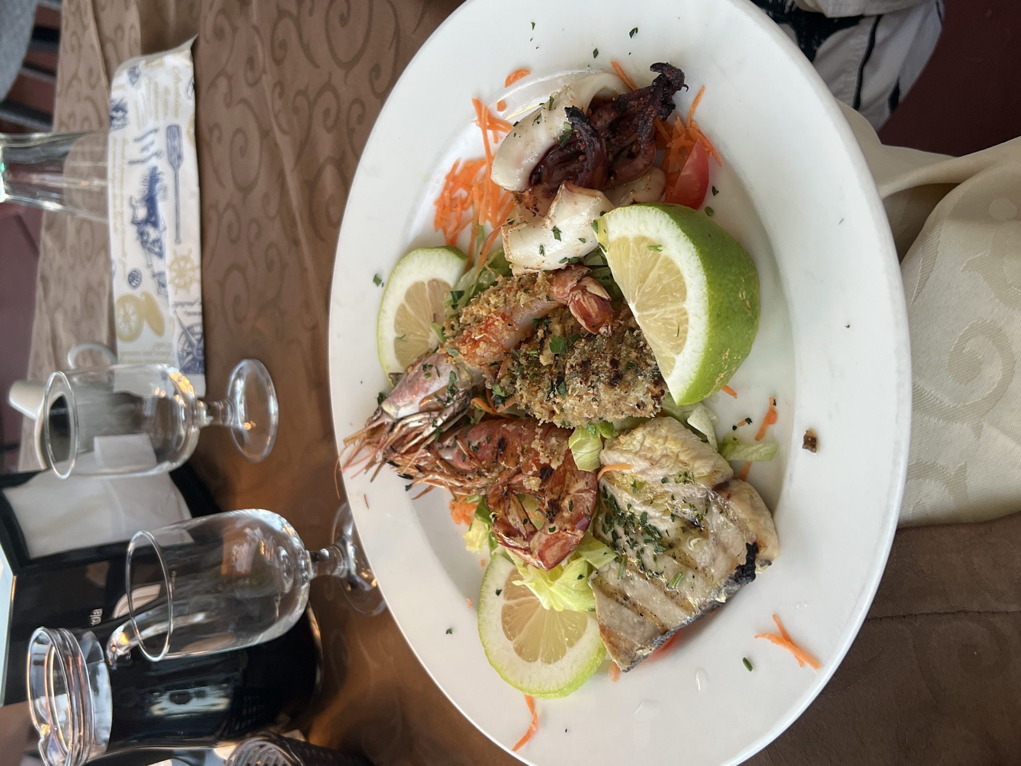 Evening seafood dining and sightseeing in coastal Letojanni, Italy