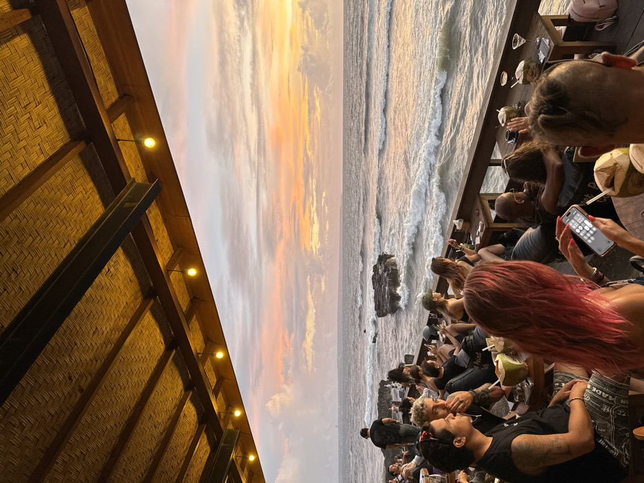 Sunset watchers gather at Canggu beachfront cafes during golden hour