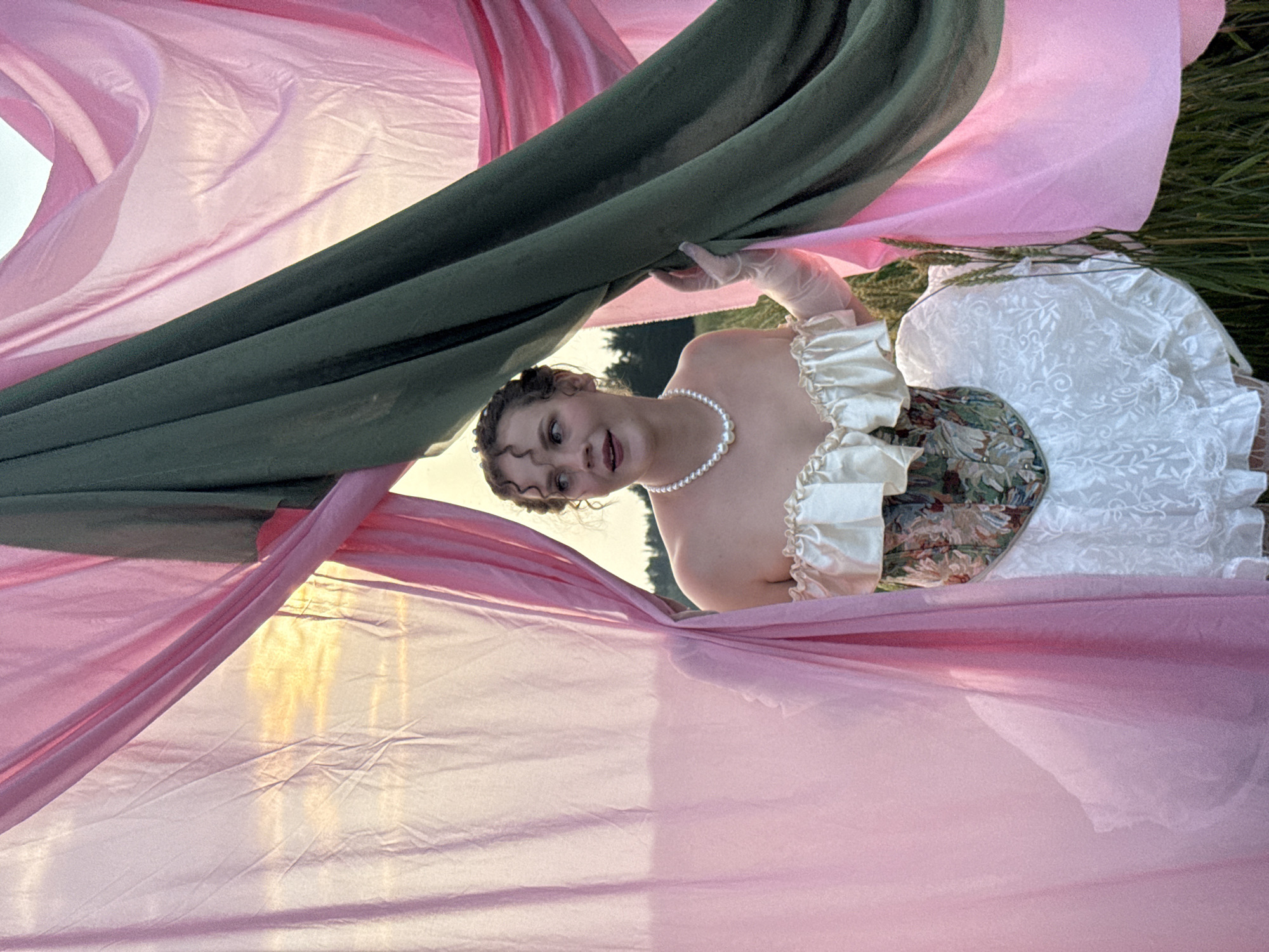 Vintage-style fashion shoot in Russian wheat fields at sunset