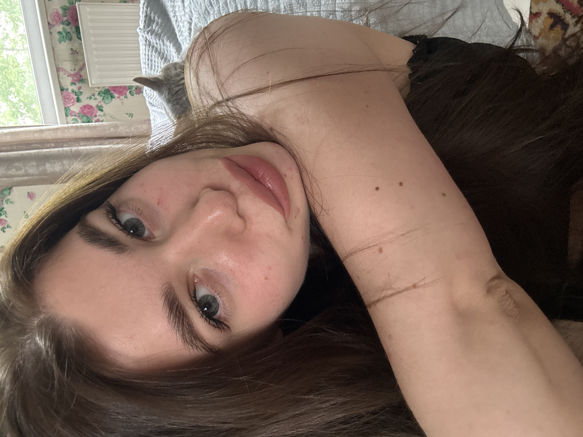 Woman with disheveled brown hair observed indoors in Russia