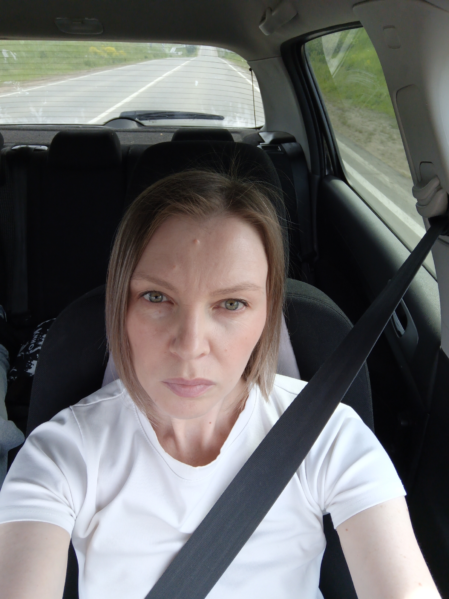 Woman photographed in passenger seat in Ольховка, Russia
