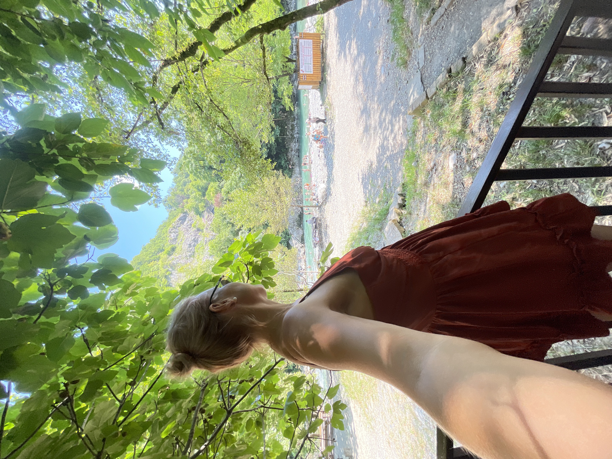 Summer crowd swims and cliff-jumps at Sochi's turquoise river gorge