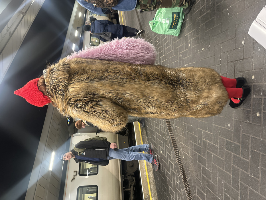 Colorfully dressed commuter spotted at London train station