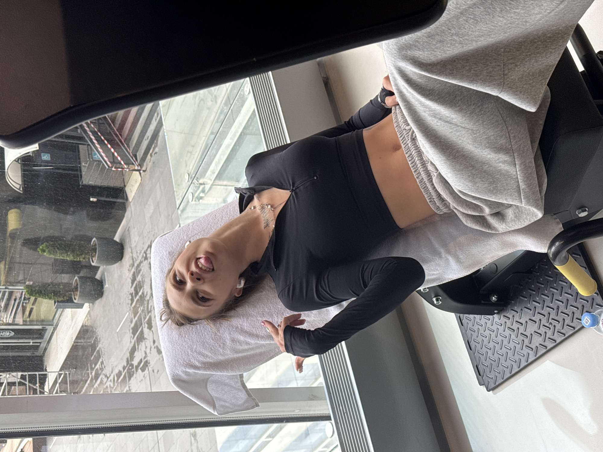 Leg press session on a Technogym machine in a Moscow gym.