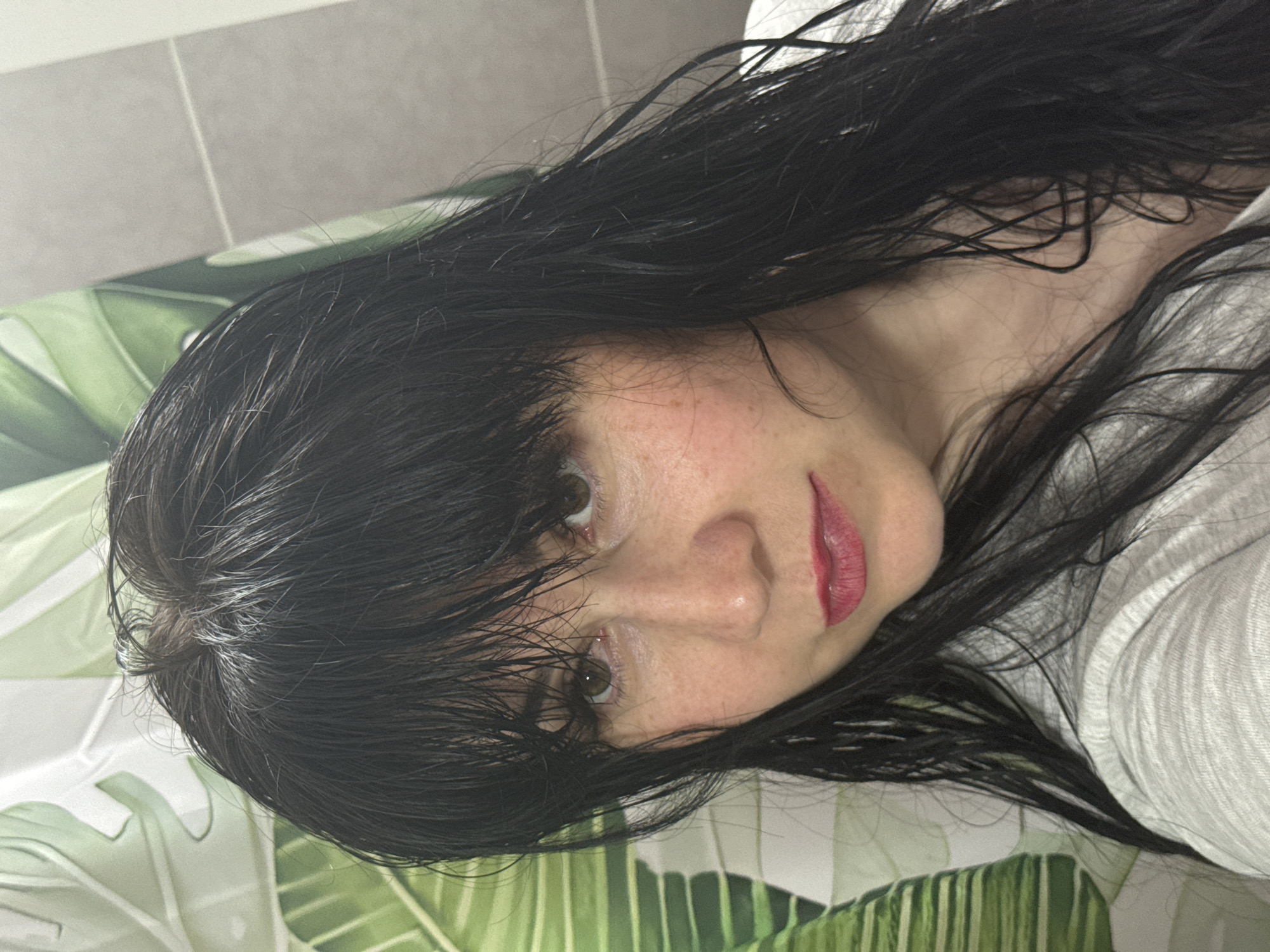 Woman's morning skincare routine documented in Zav'yalovo bathroom