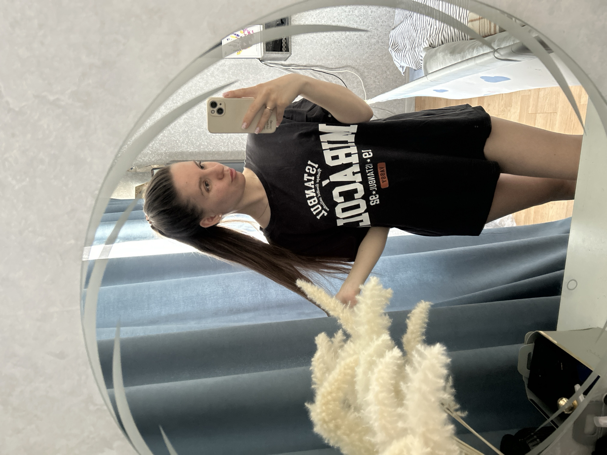 Woman takes mirror selfie in Klin, Russia