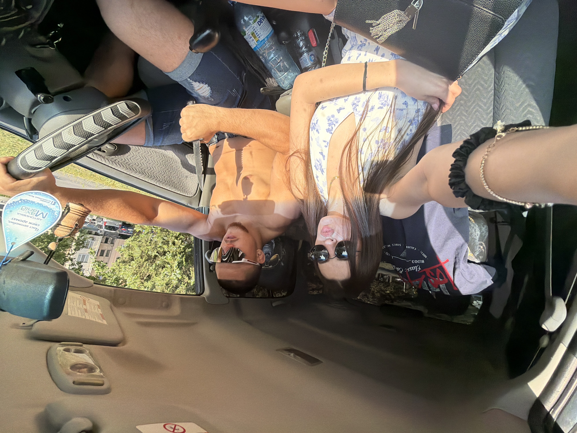 Woman takes selfie in passenger seat during daylight in Plovdiv