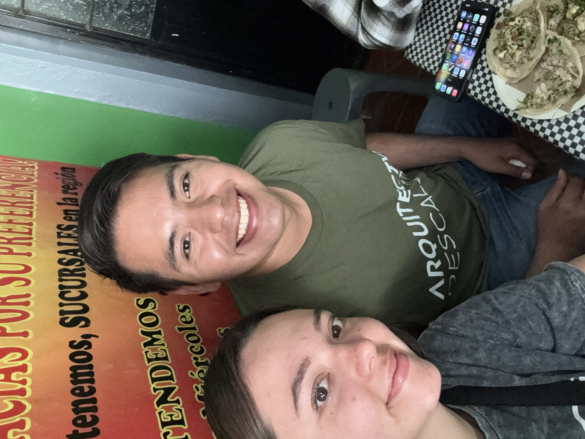 Couple takes selfie at restaurant in Cuetzalan, Mexico