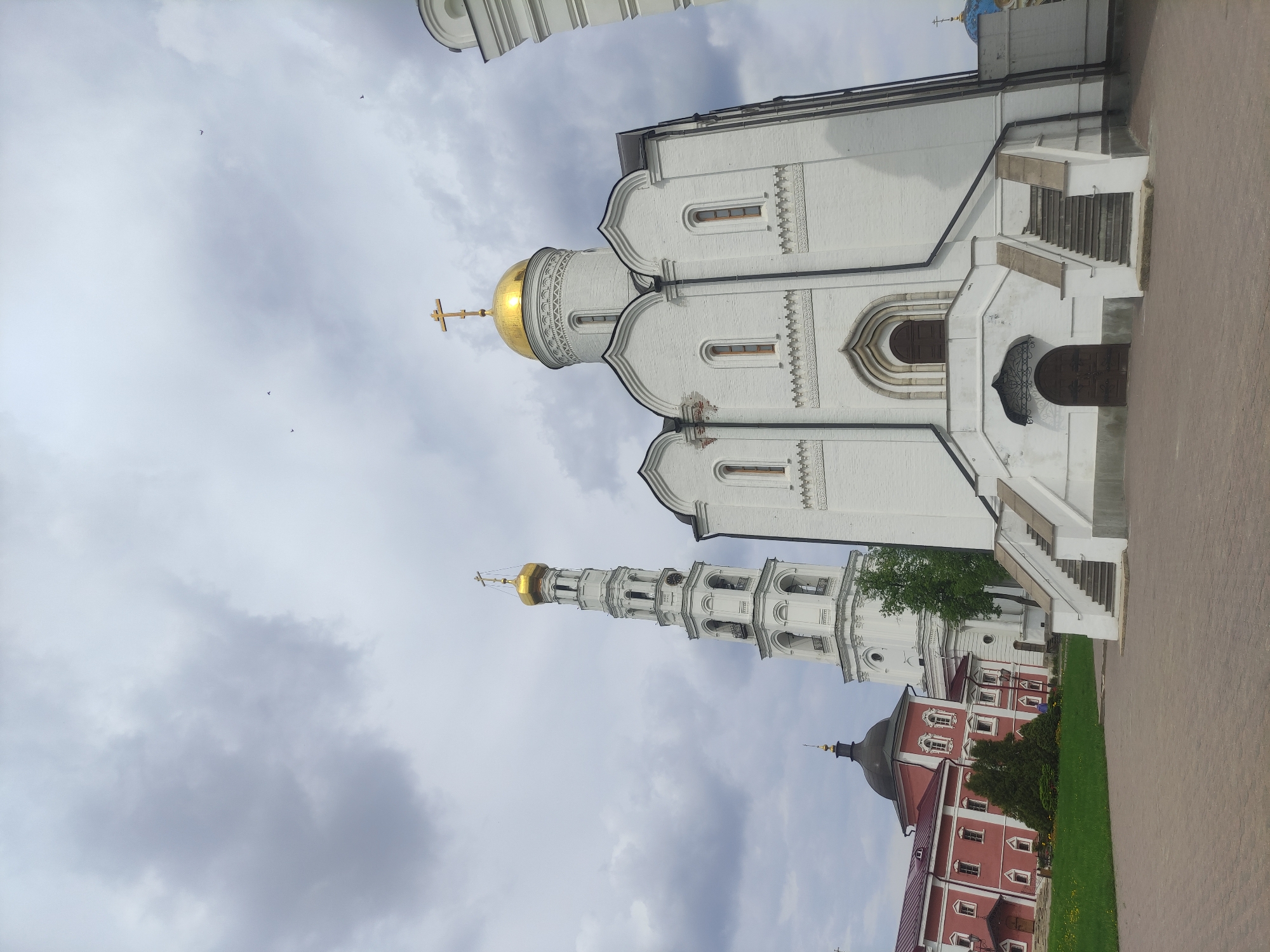 Visitor documents Orthodox monastery grounds and wildlife in Dzerzhinsky