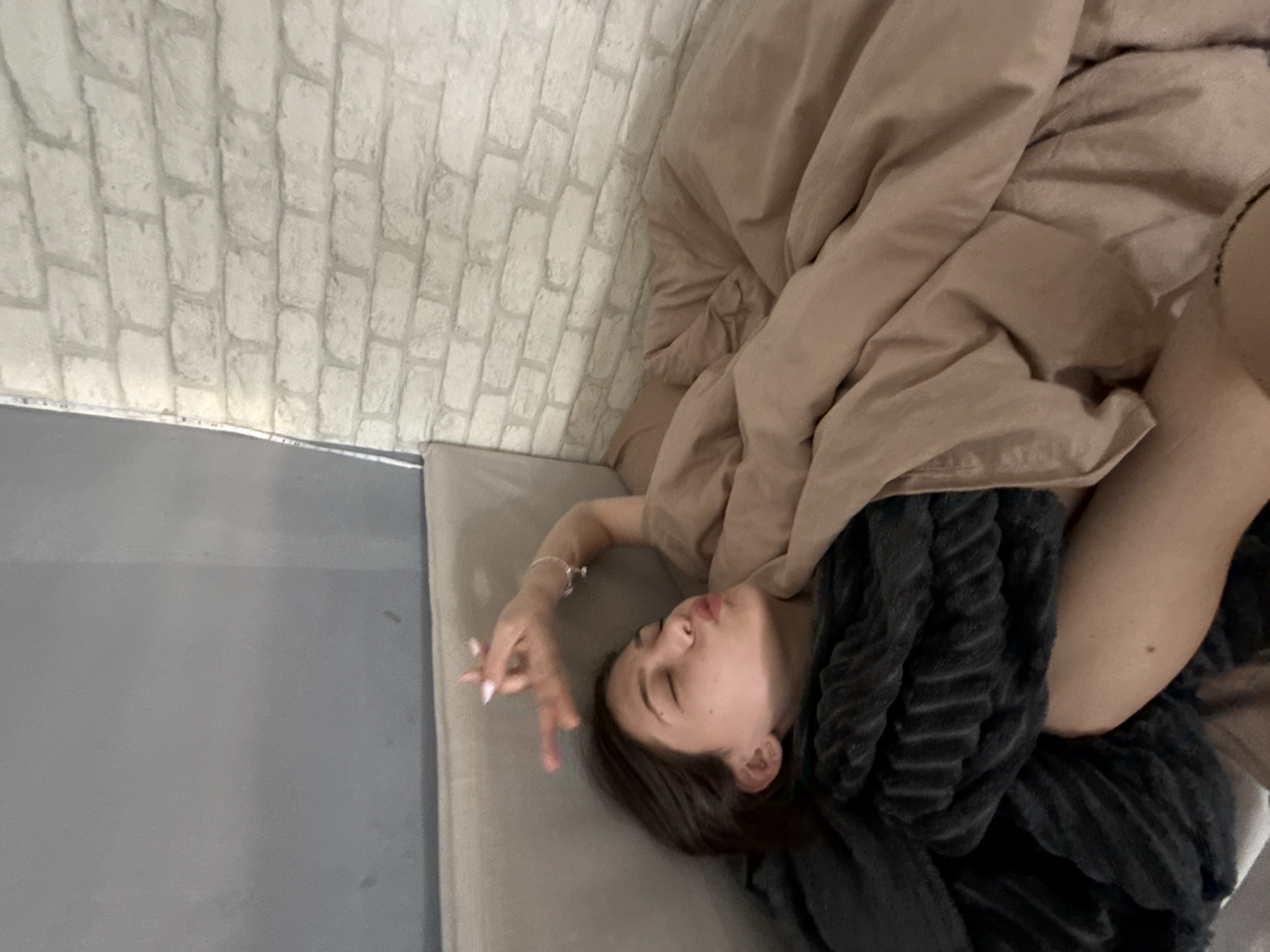 Woman photographed resting in bed in Sofia morning