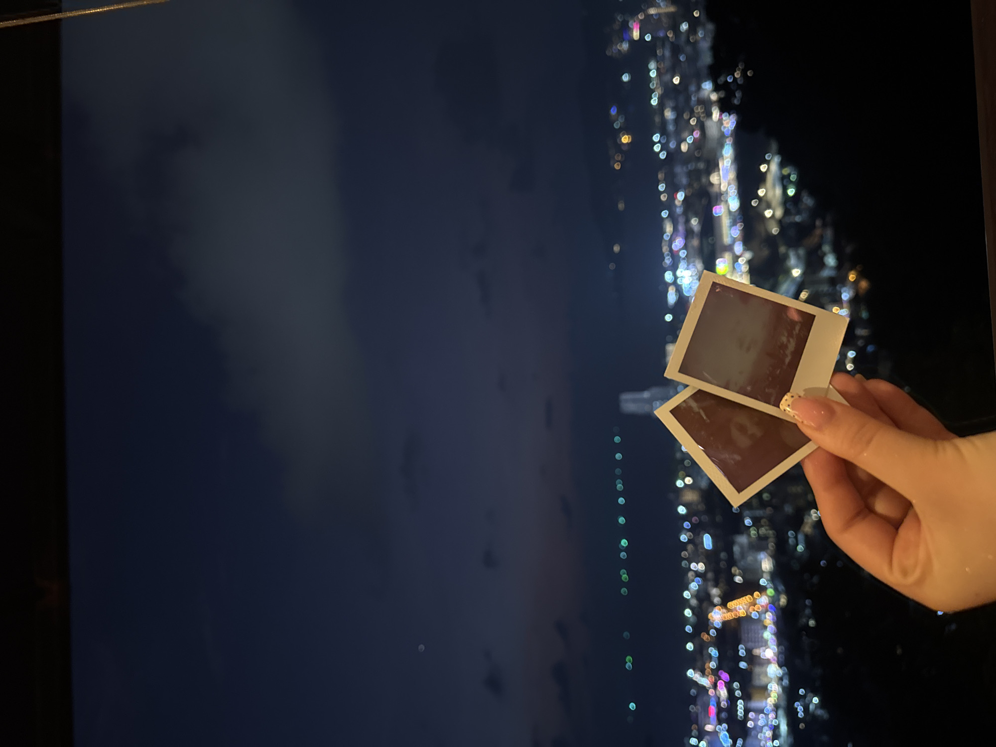 Nighttime moments captured in Patong: instant photos and resting dog