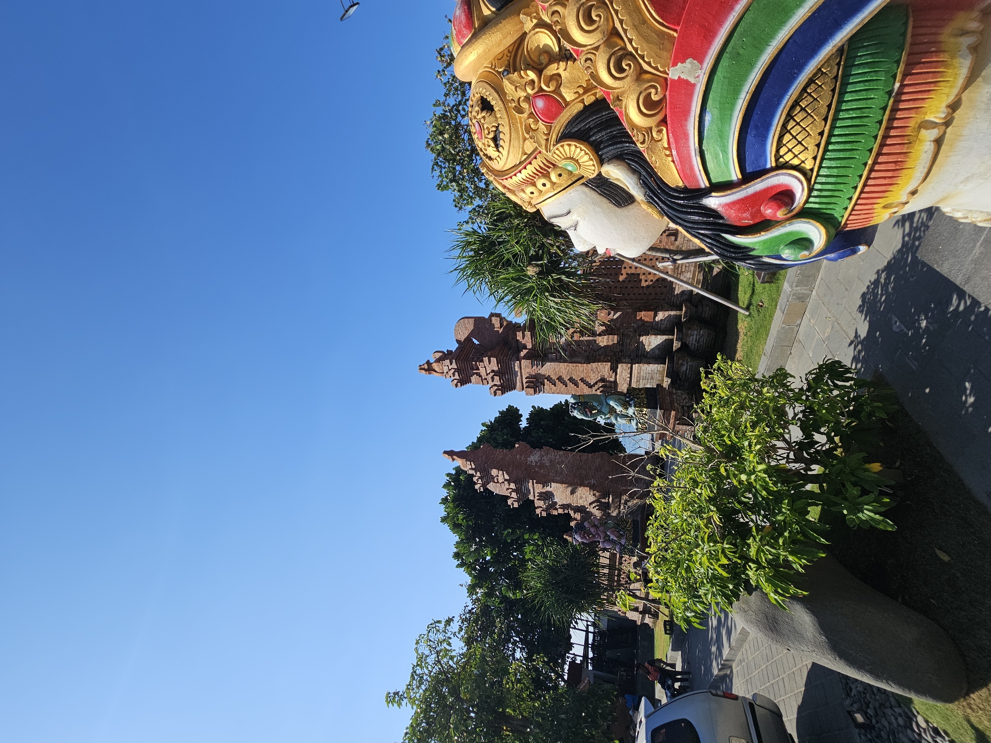 Denpasar's coastline and monuments on a busy July morning
