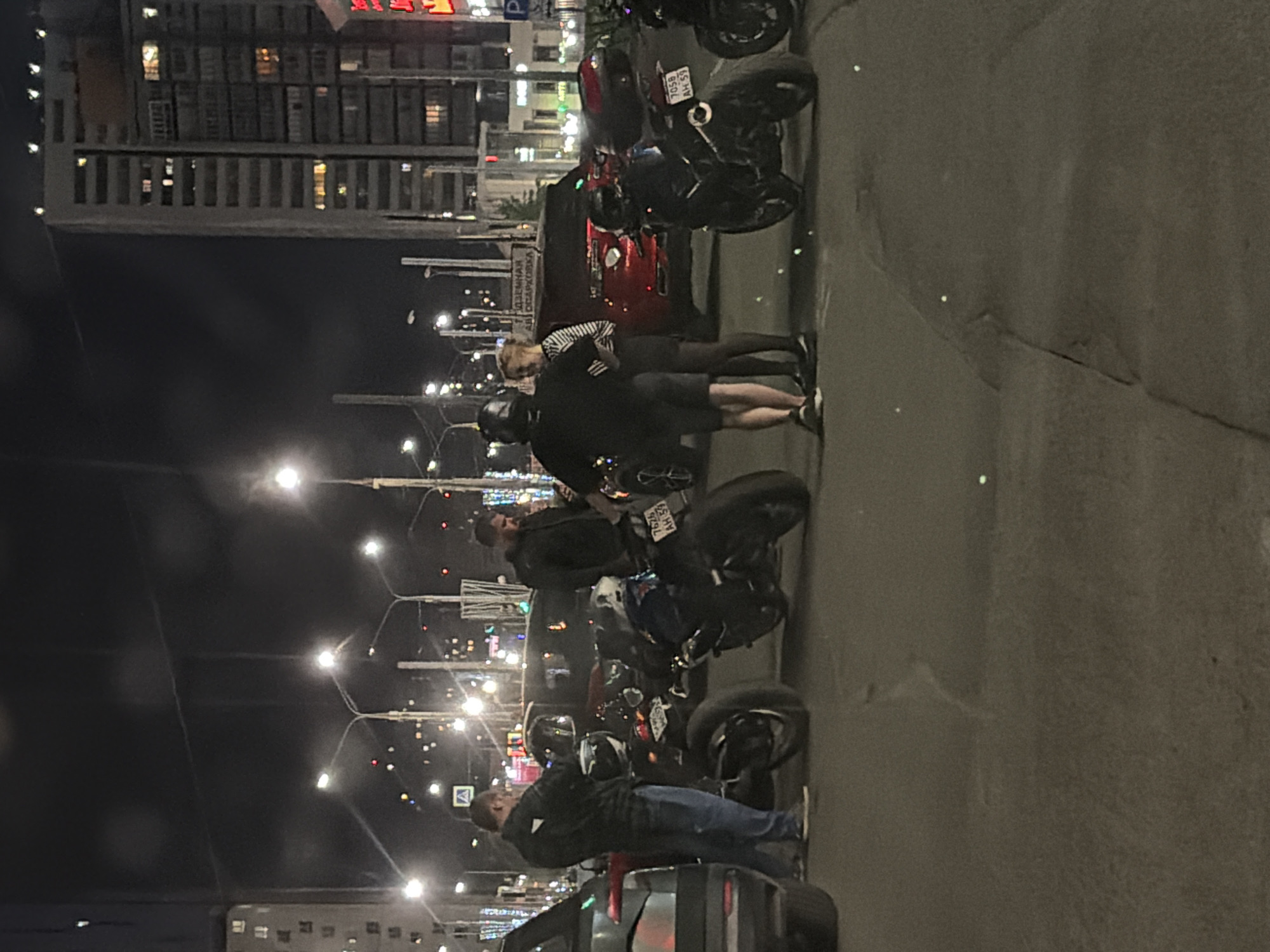 Nighttime street scenes and vehicle displays captured in Perm