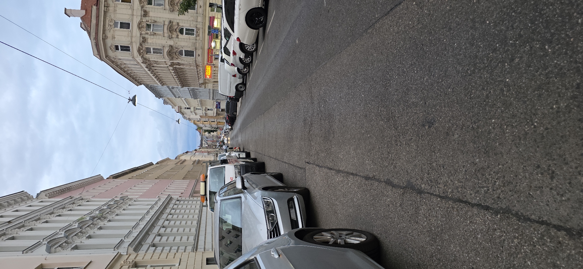 Street-level view down a Vienna city block