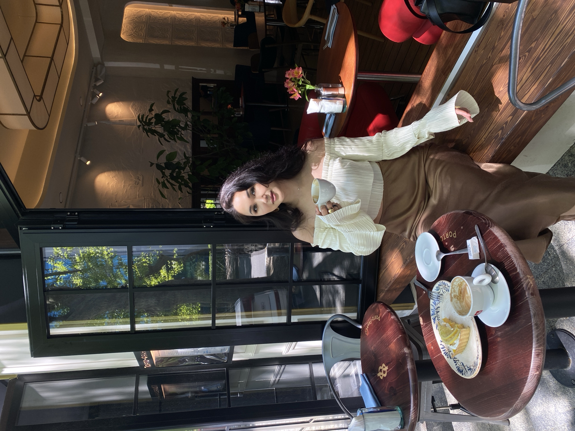Woman enjoys leisurely morning at Sochi cafes and parks