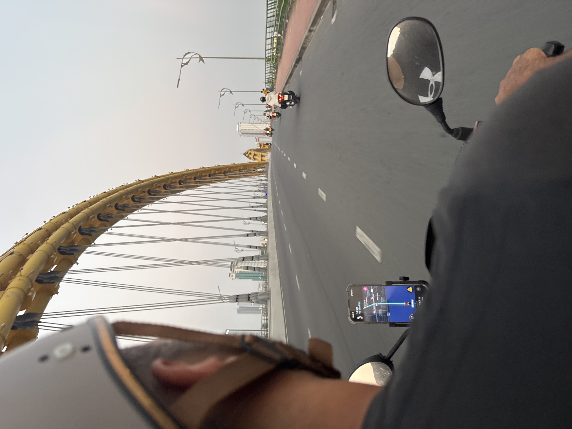 Motorcyclist crosses Dragon Bridge in Đà Nẵng, Vietnam