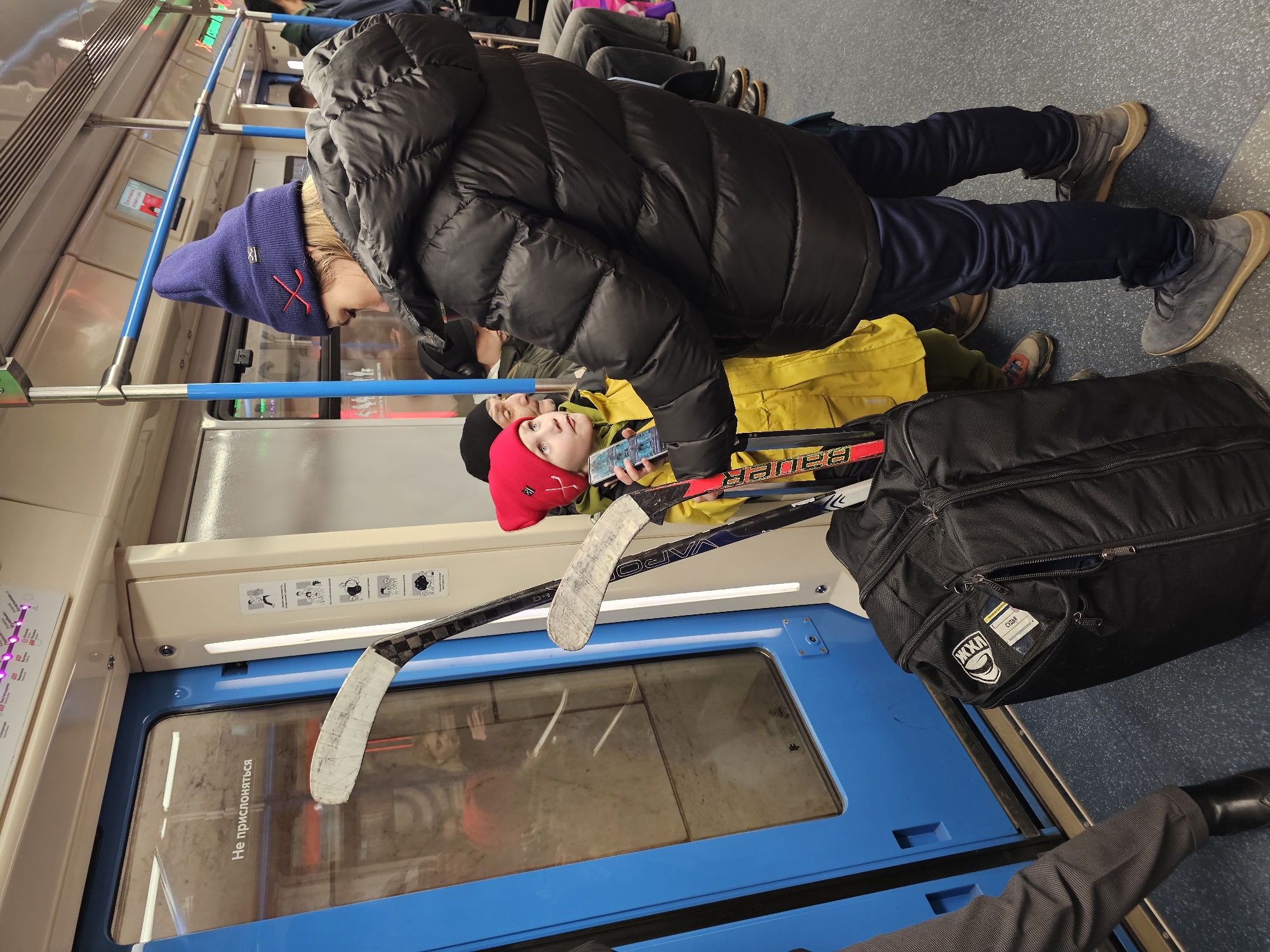 Adult and child observed together on Moscow Metro train
