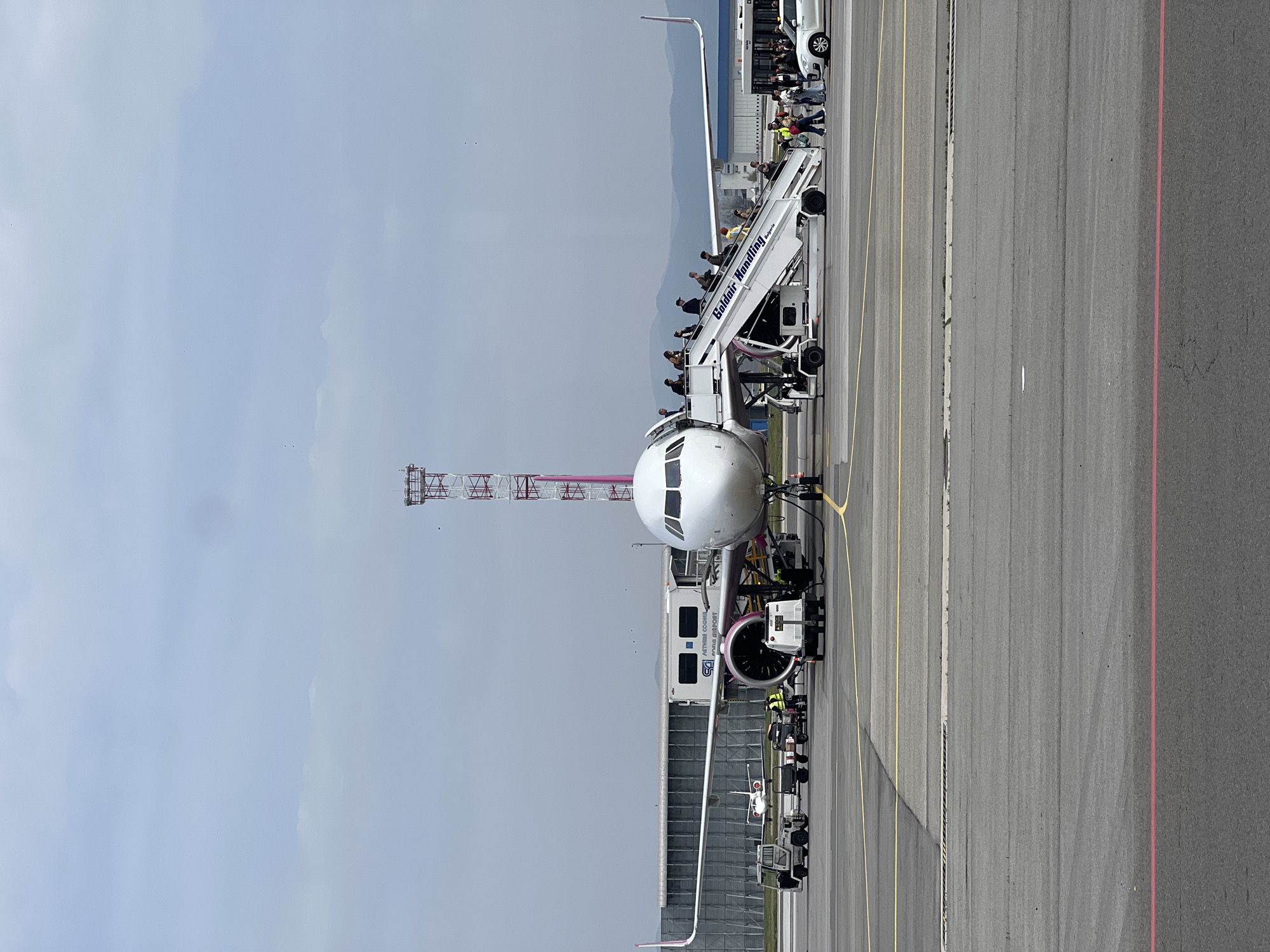 Airbus A320 parked at Sofia Airport with ground support