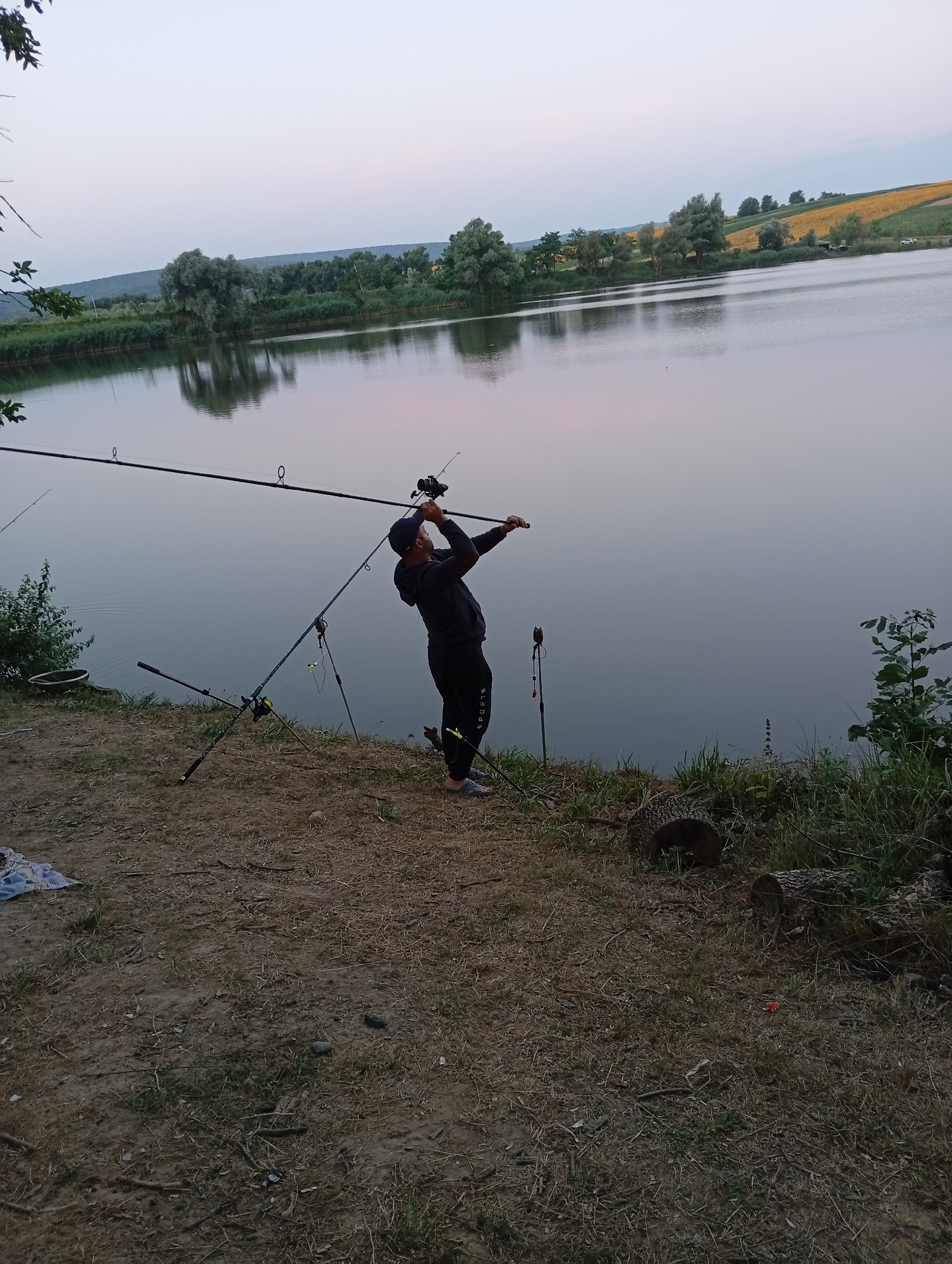 Evening fishing at a lakeside spot in rural Moldova