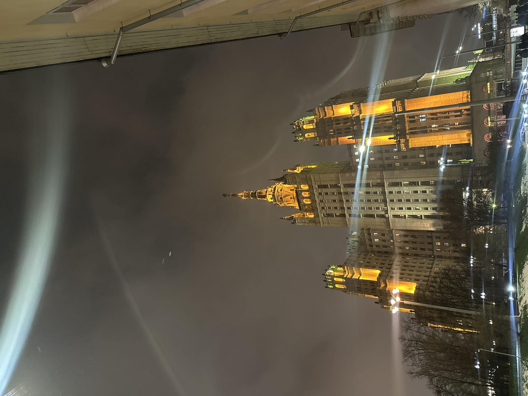 Moscow evening scenes: illuminated buildings and yellow strap interaction