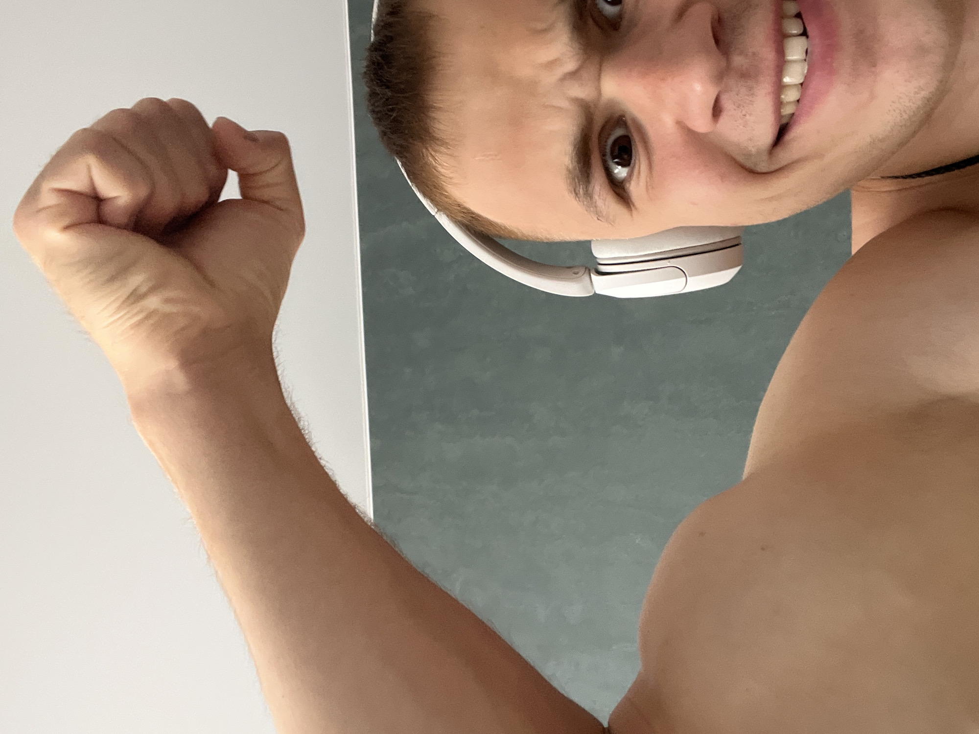 Selfie series: flexing and goofing around with white headphones
