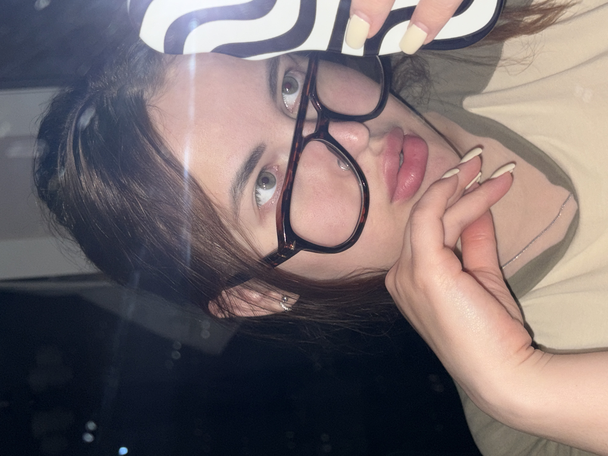 Woman with striped object observed indoors at night in Shendzhii