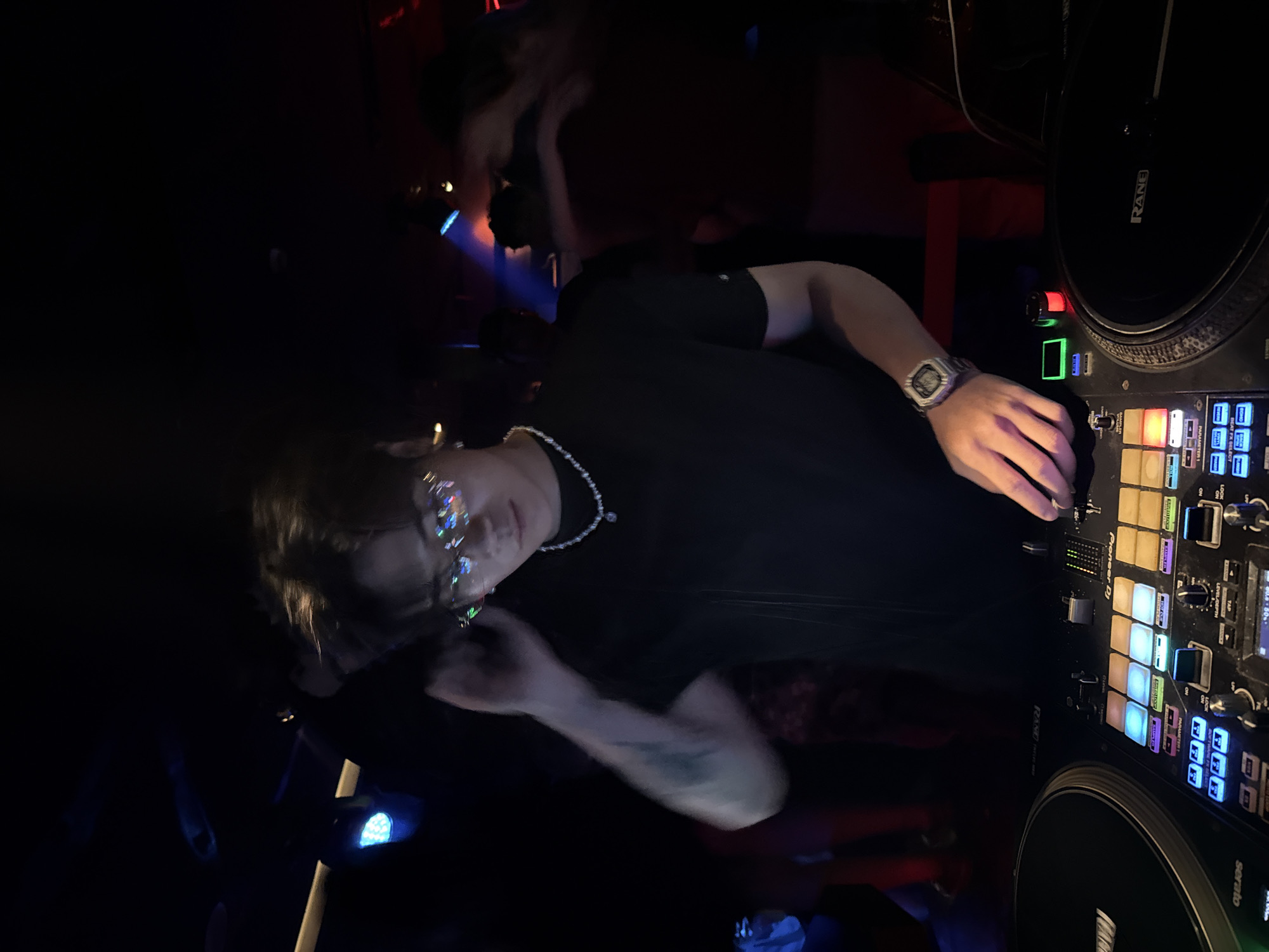 Nightclub scene captured in Liangjiang, China during evening hours