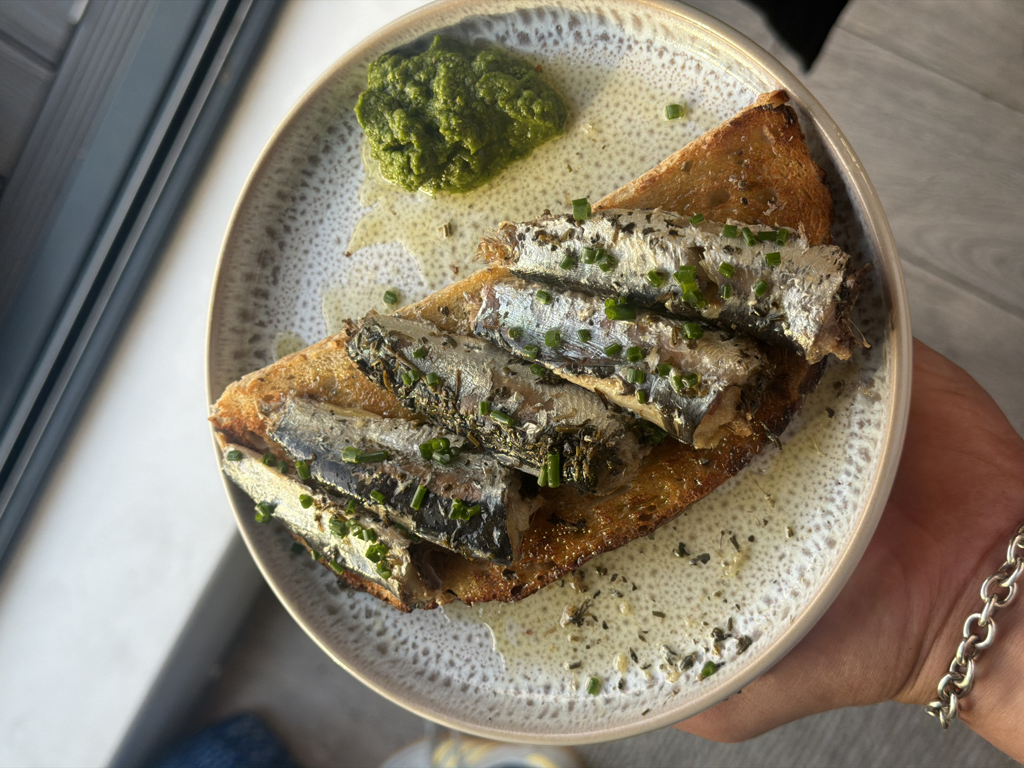 Sardines on toast and a cat chilling at home in London