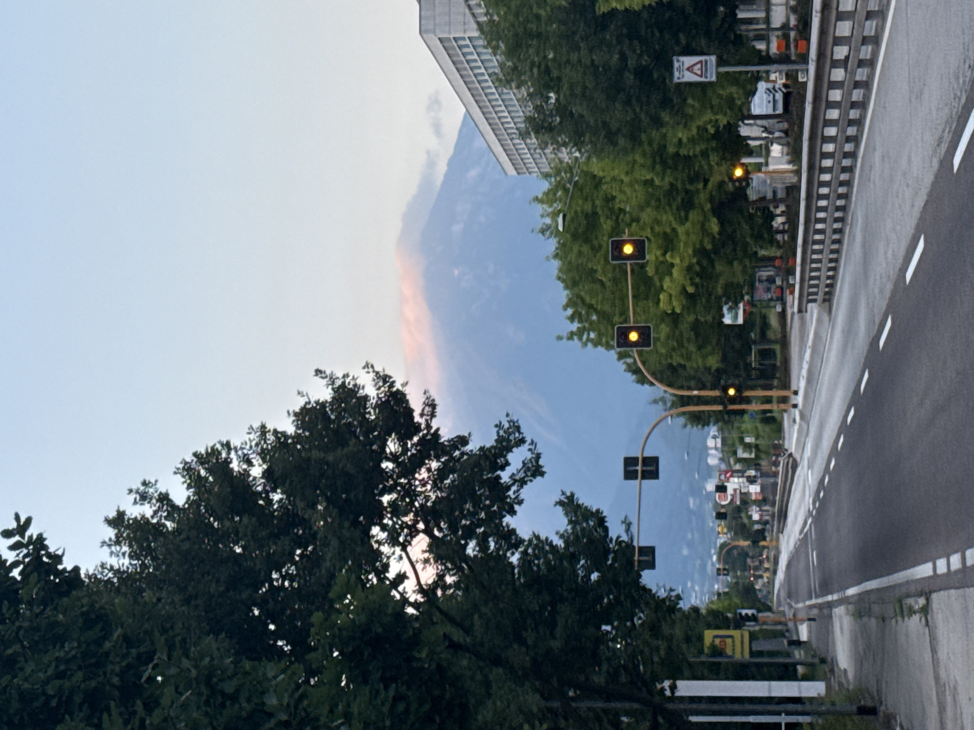 Trento streets and mountain landscape at dawn