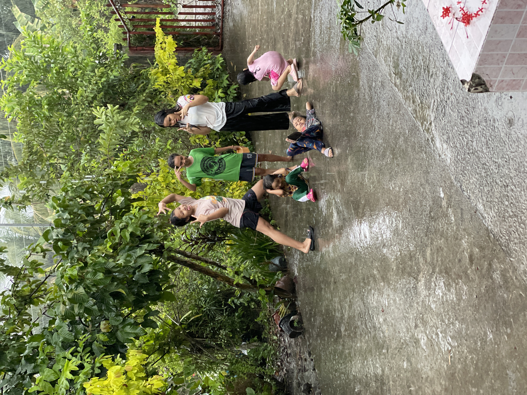 Children play in rain, daily life captured in Kiblawan Philippines