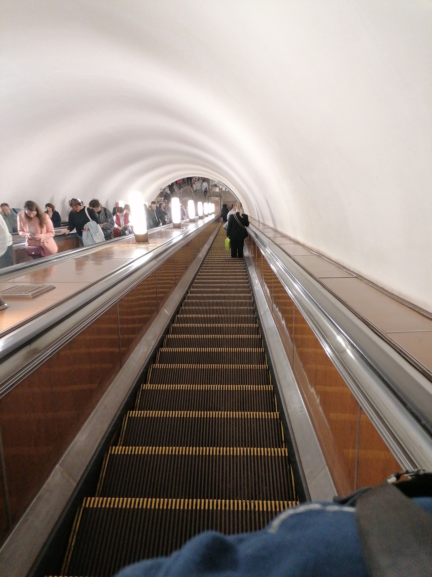 Morning commute through deep subway tunnels and stations documented