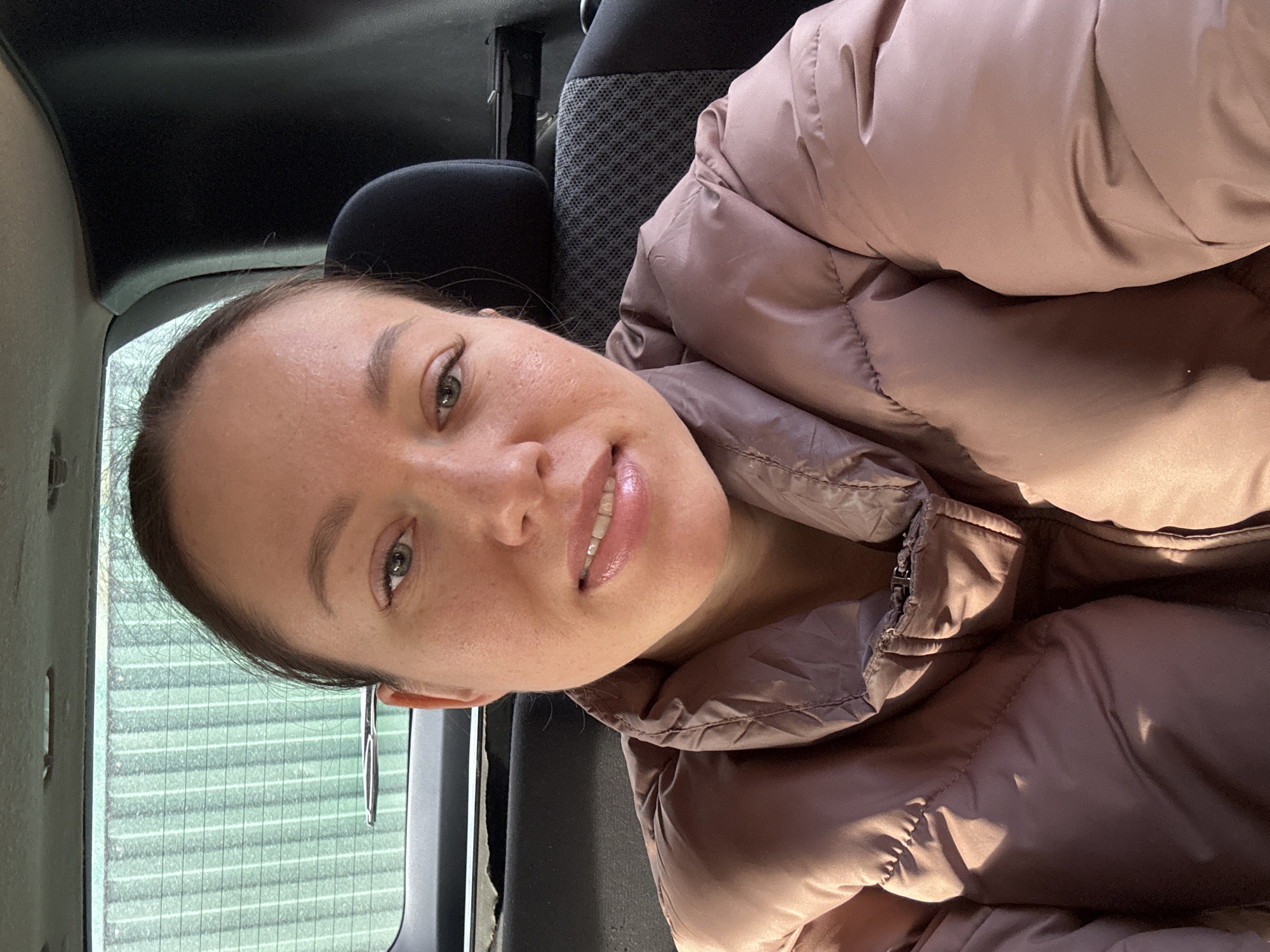 Mother and child photographed in vehicle during early morning
