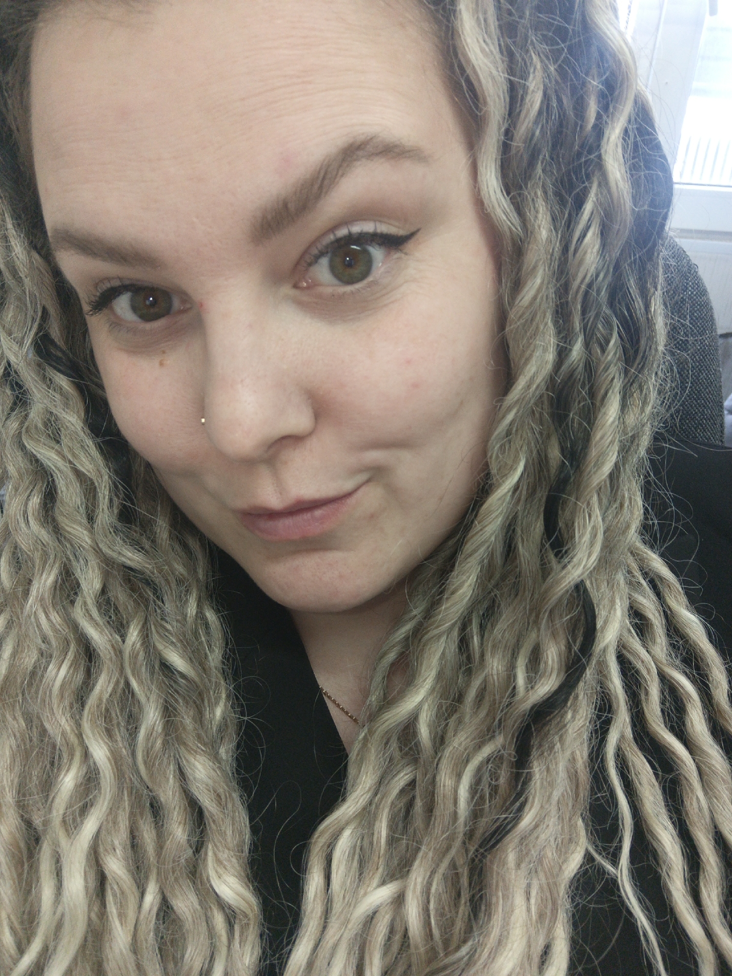 Woman takes multiple selfies during daily activities in Noviy