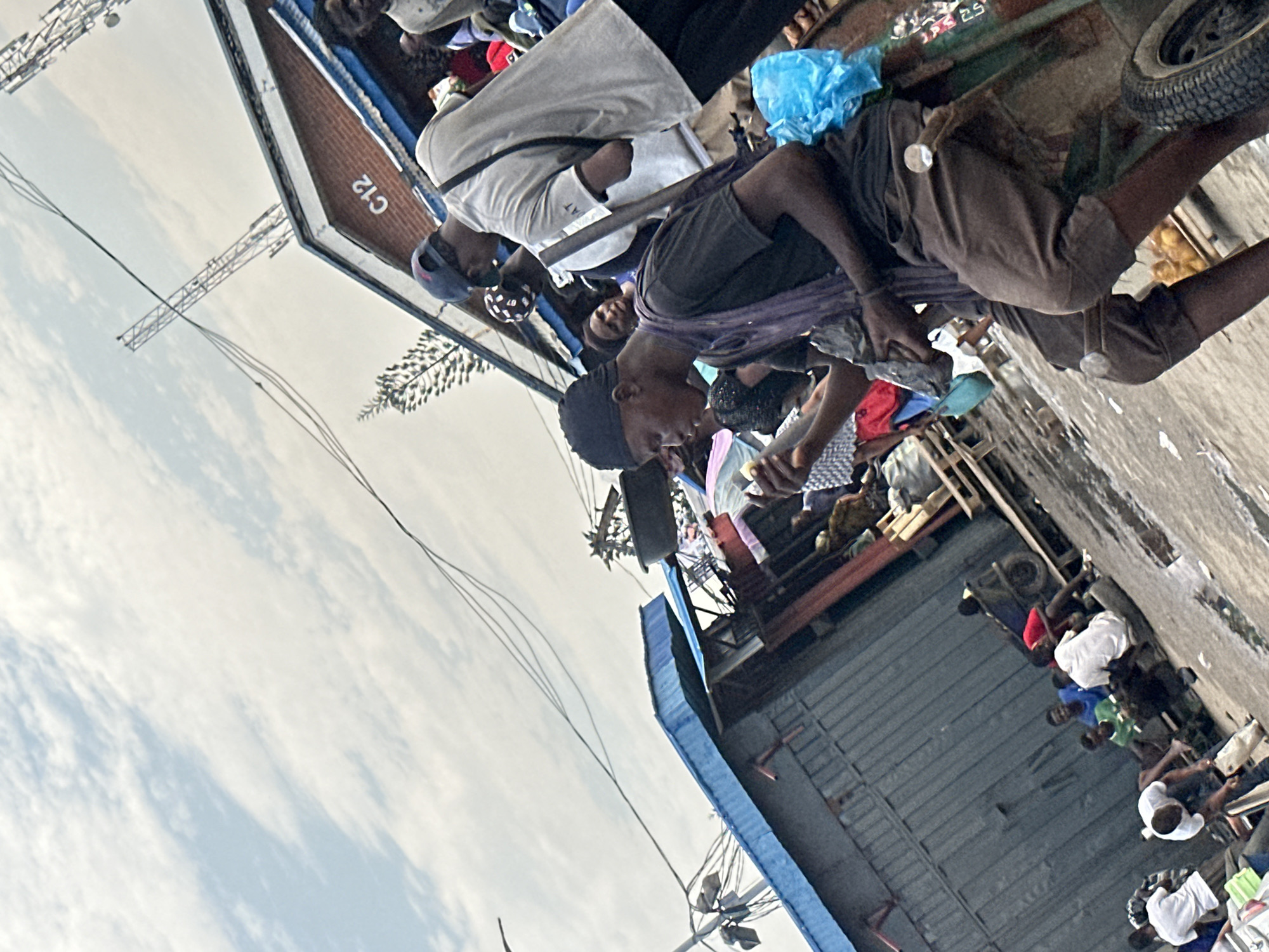 Street-level activity at a busy Ikeja market
