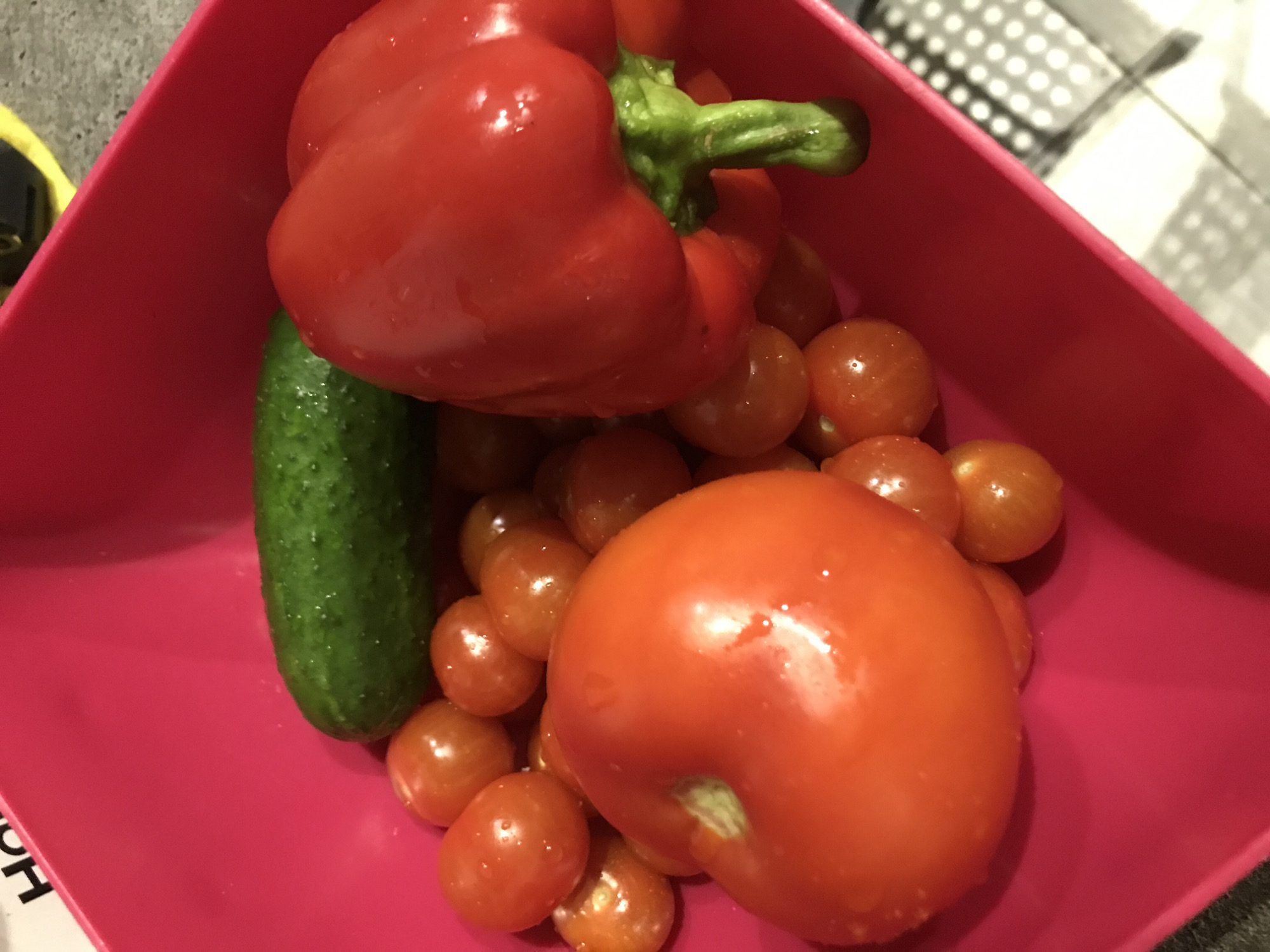 Fresh vegetables displayed in pink container in Sochi