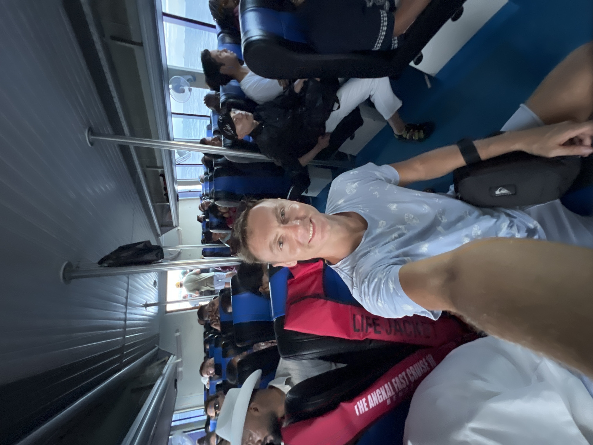 Passenger captures selfie moment aboard ferry near Denpasar
