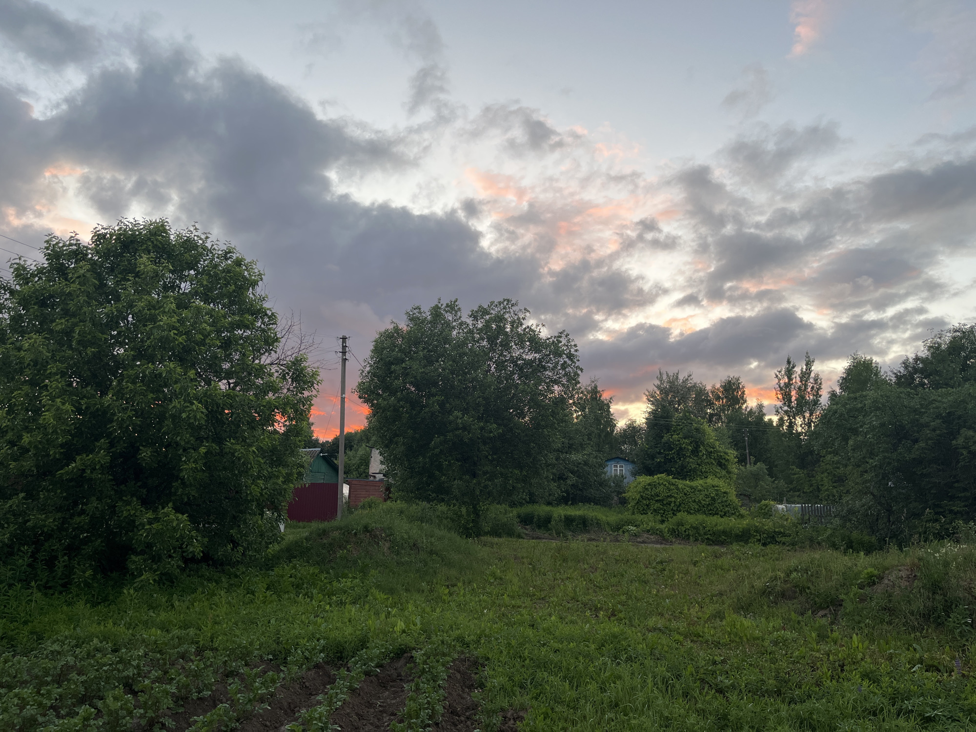 Summer sunset evening at a rural Russian village property