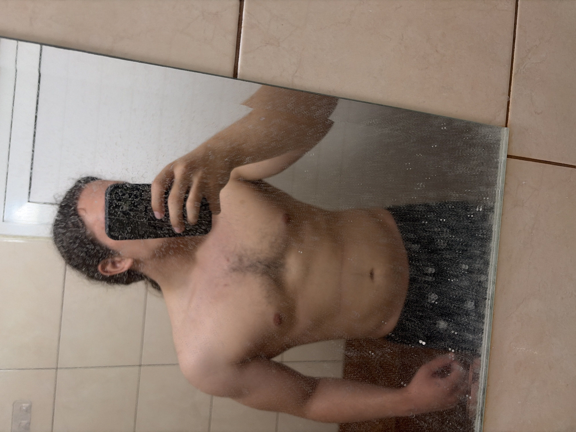 Person takes multiple mirror selfies in Plovdiv bathroom