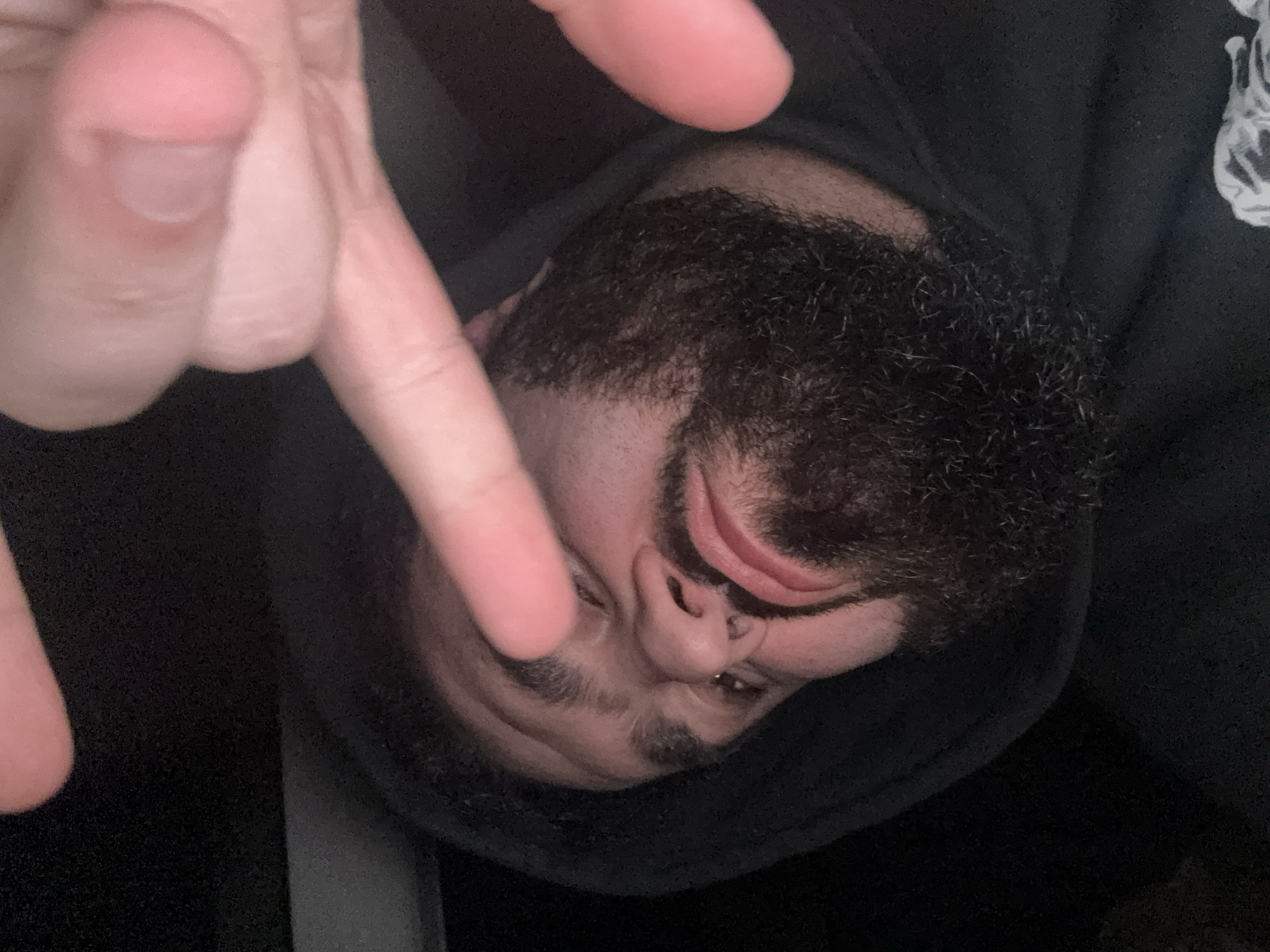 Close-up portrait captured in Yerevan showing hooded figure