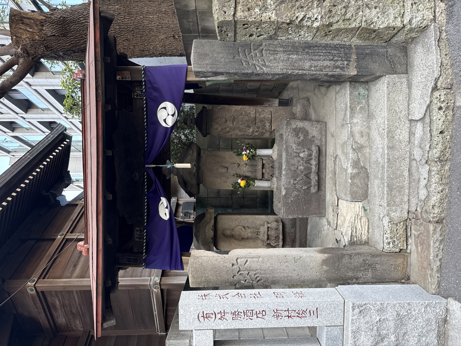 Traditional Shinto shrine with stone carvings observed in Minato
