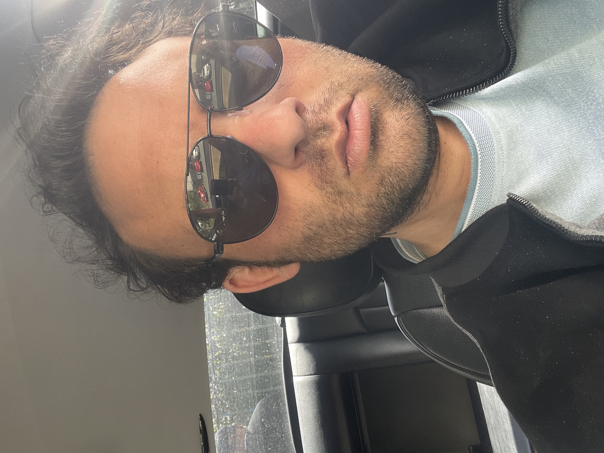 Man in sunglasses observed in parked car, Portadown