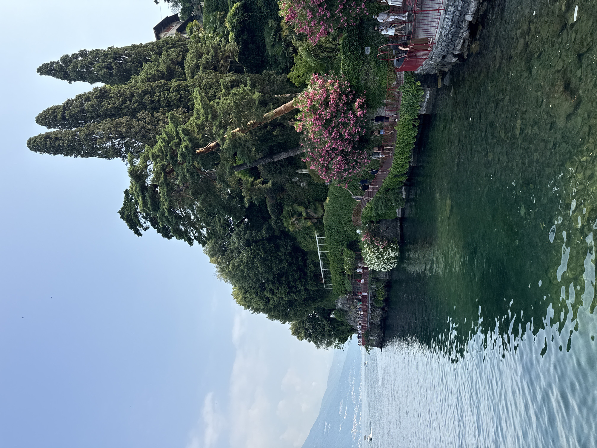 Varenna's Lake Como waterfront buzzing on a clear summer morning