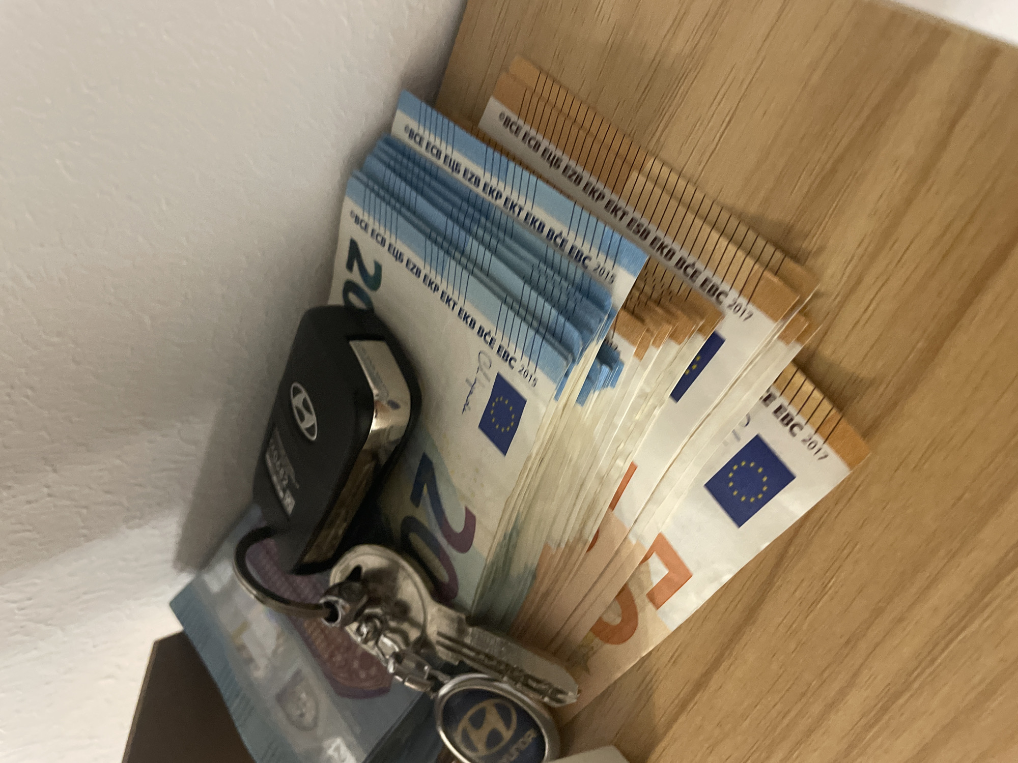 Late-night hotel check-in with cash and car keys on hand