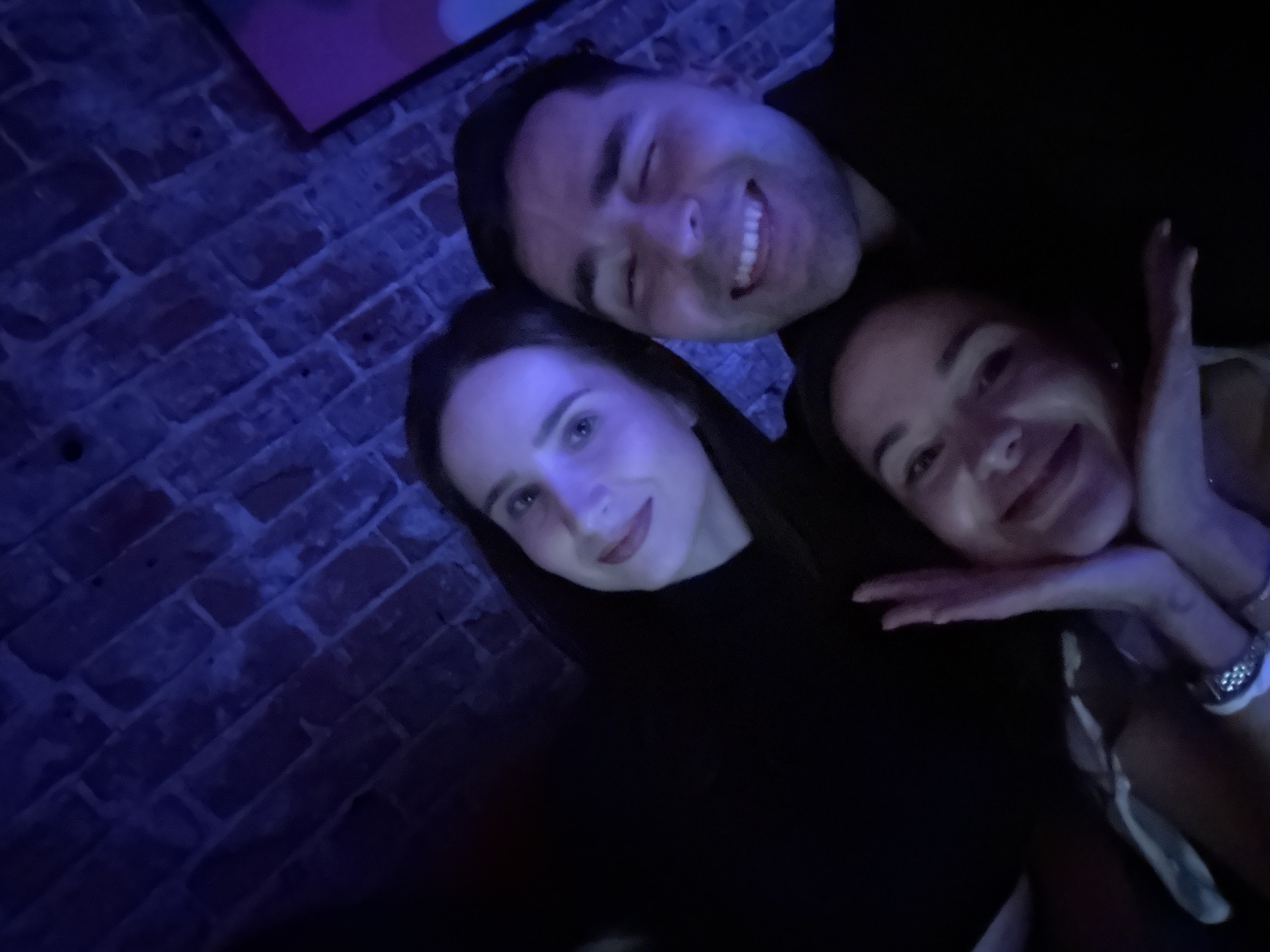 Three people photographed at indoor venue in Krasnoyarsk