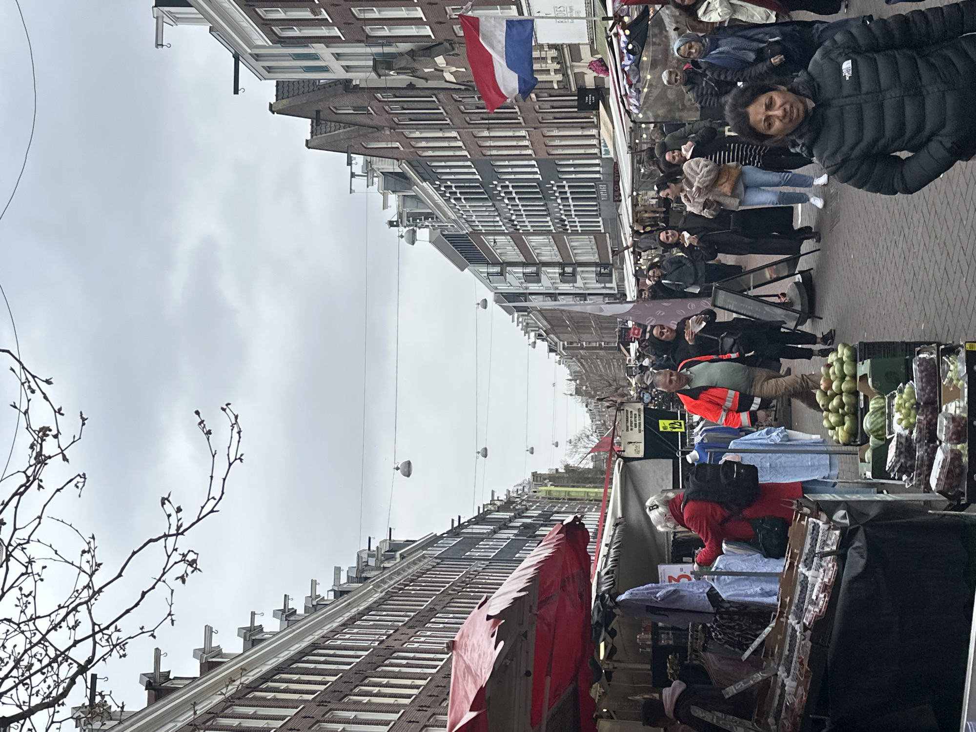 Amsterdam street market and escalator scenes captured simultaneously
