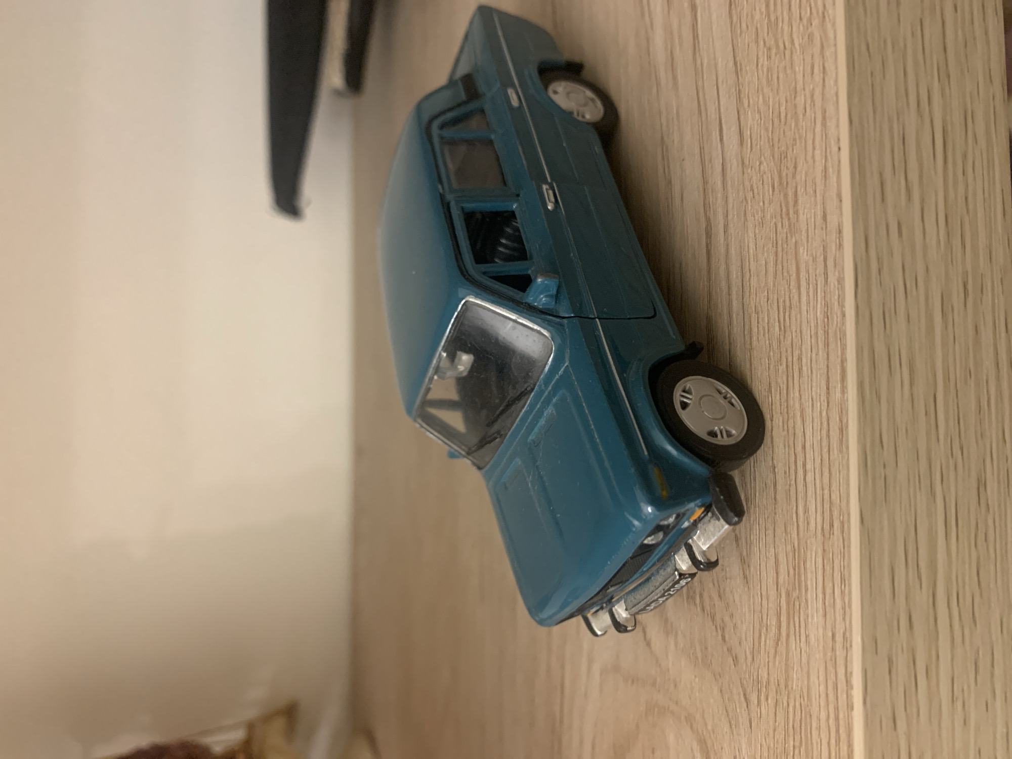 Toy cars and decorative collectibles on display in Kutaisi
