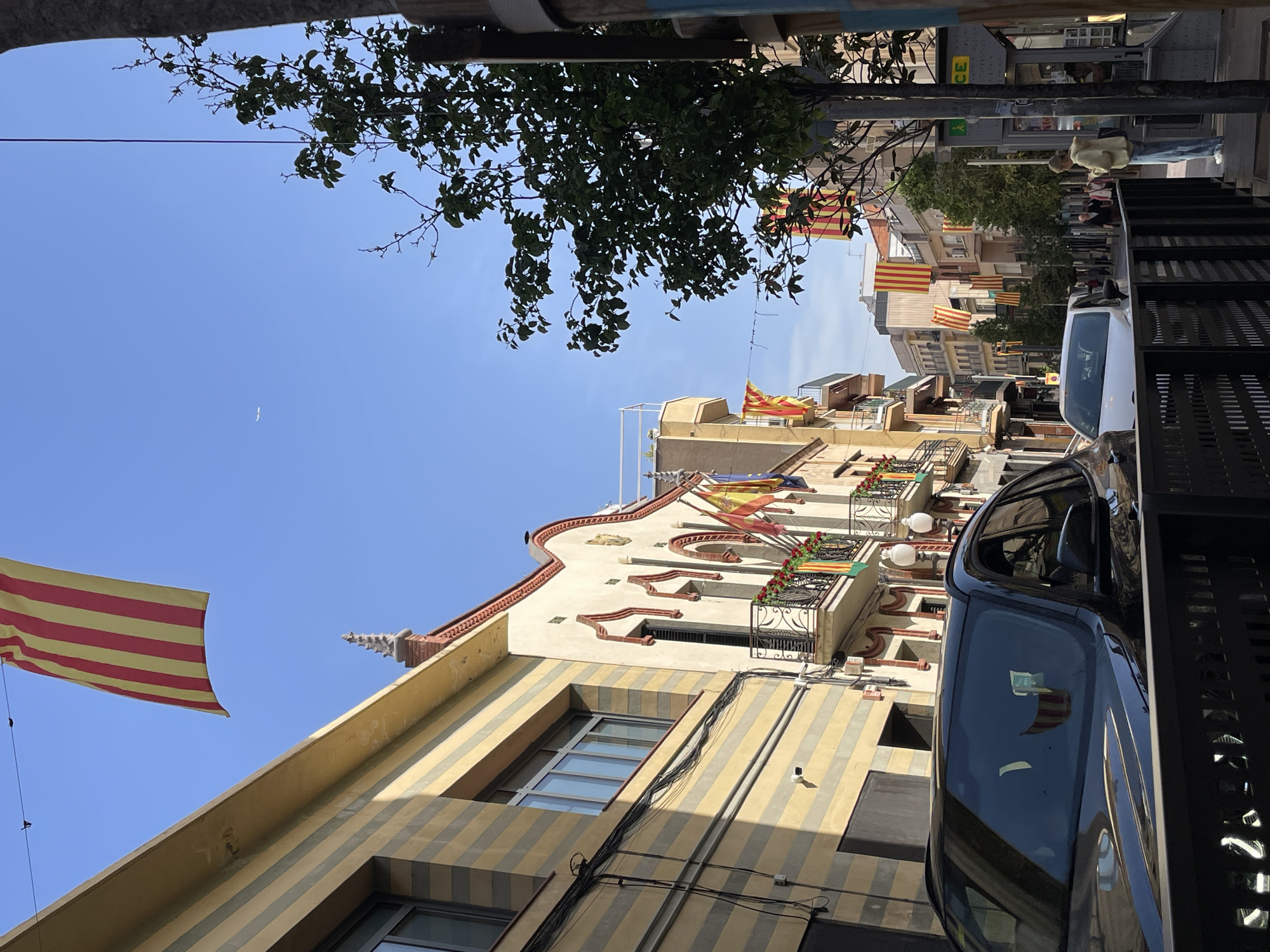 Morning scenes captured in Montcada: Catalan flags, administrative office