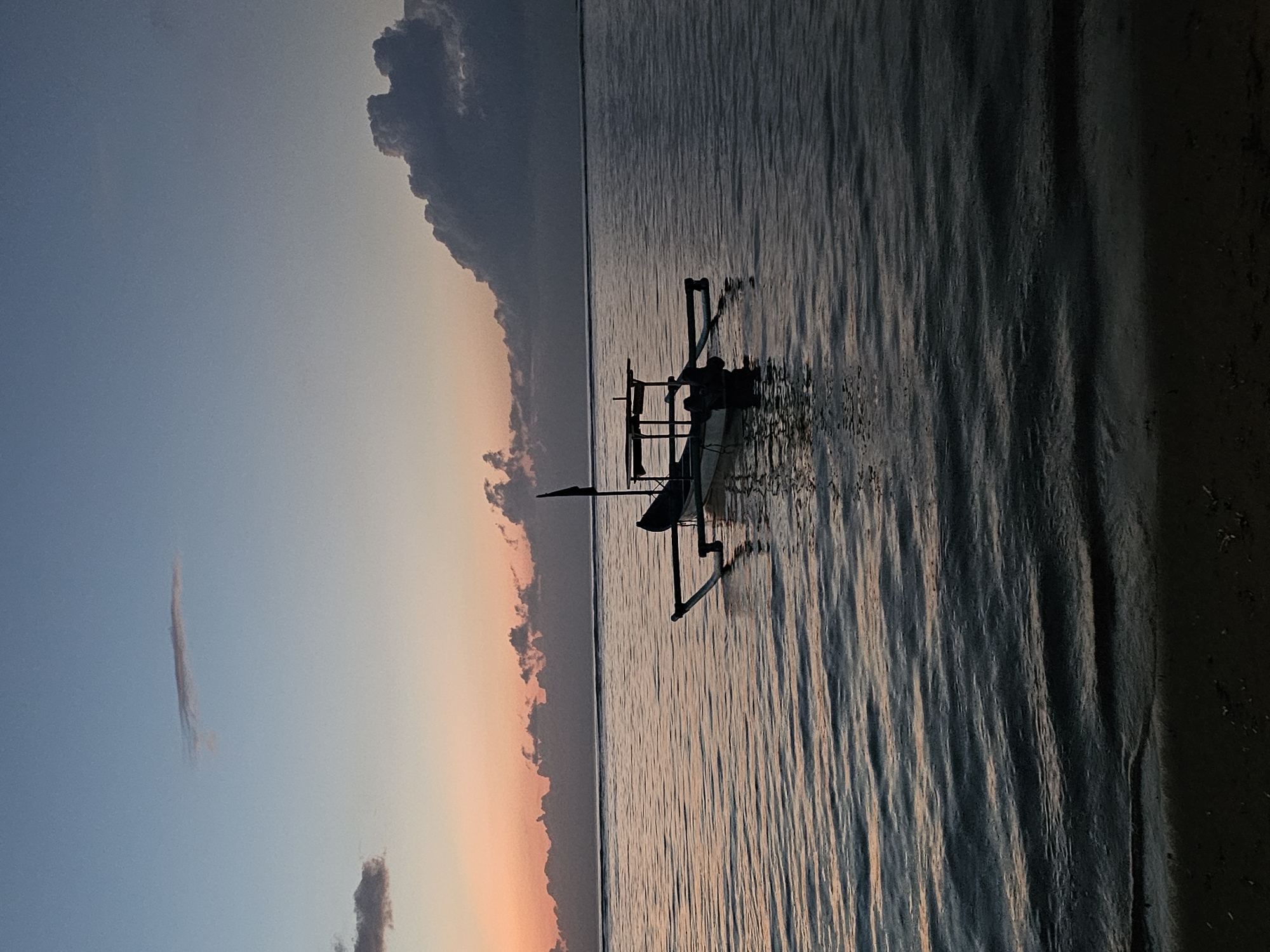 Traditional fishing boats observed at sunset in Denpasar waters