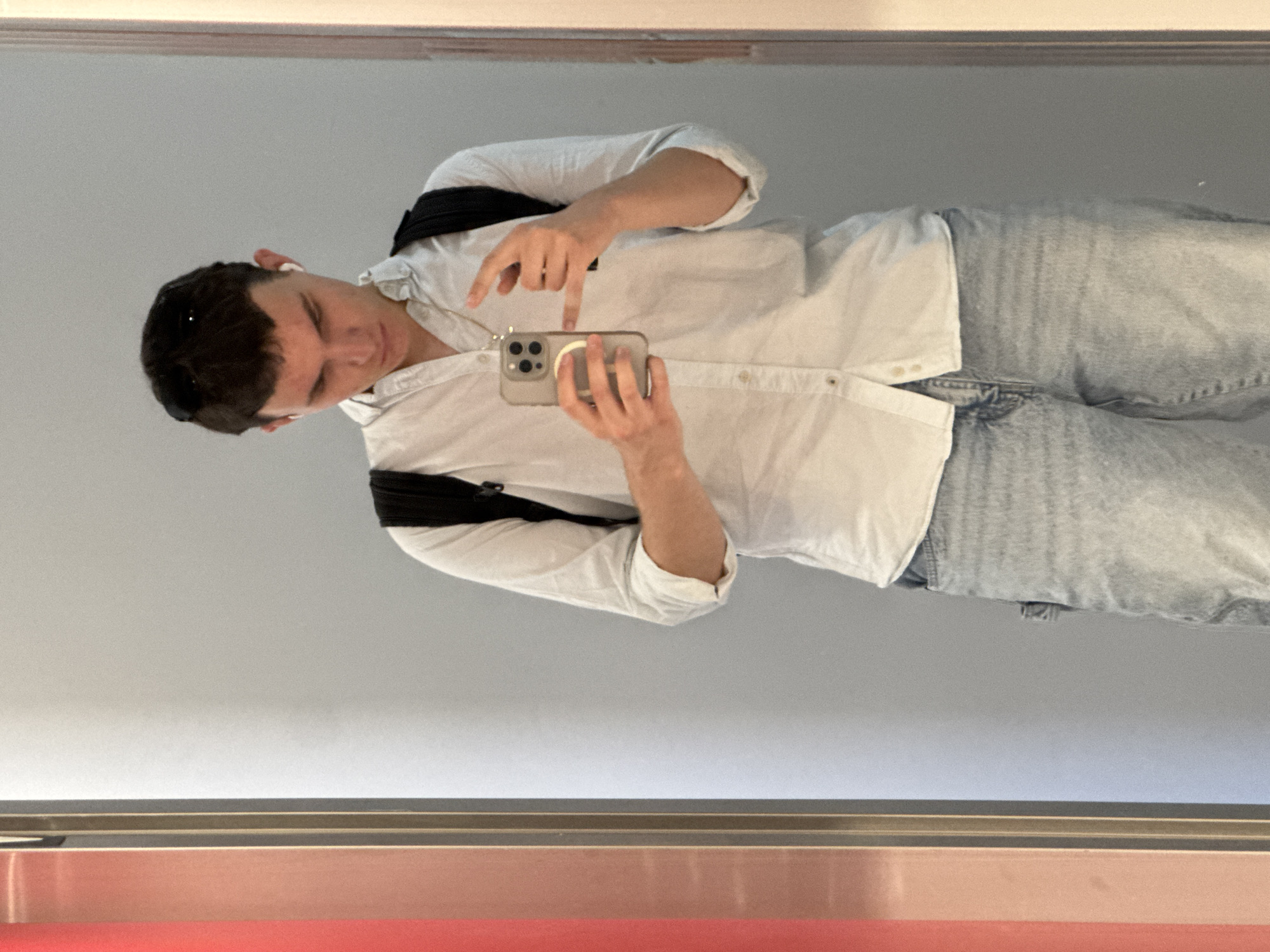 Young man takes elevator selfies in Sofia