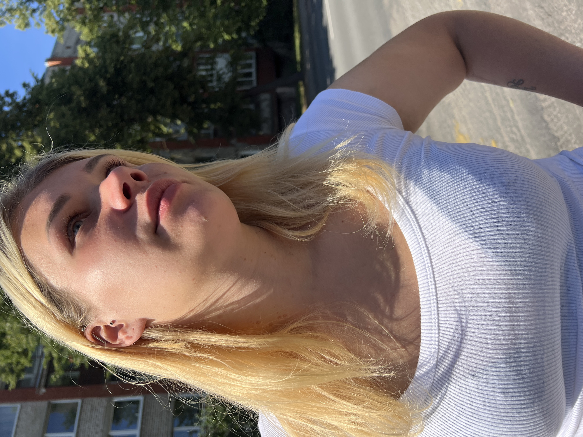 Pause on a sunny Riga sidewalk, summer afternoon